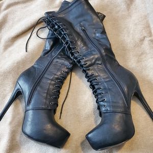 Black knee length boots.